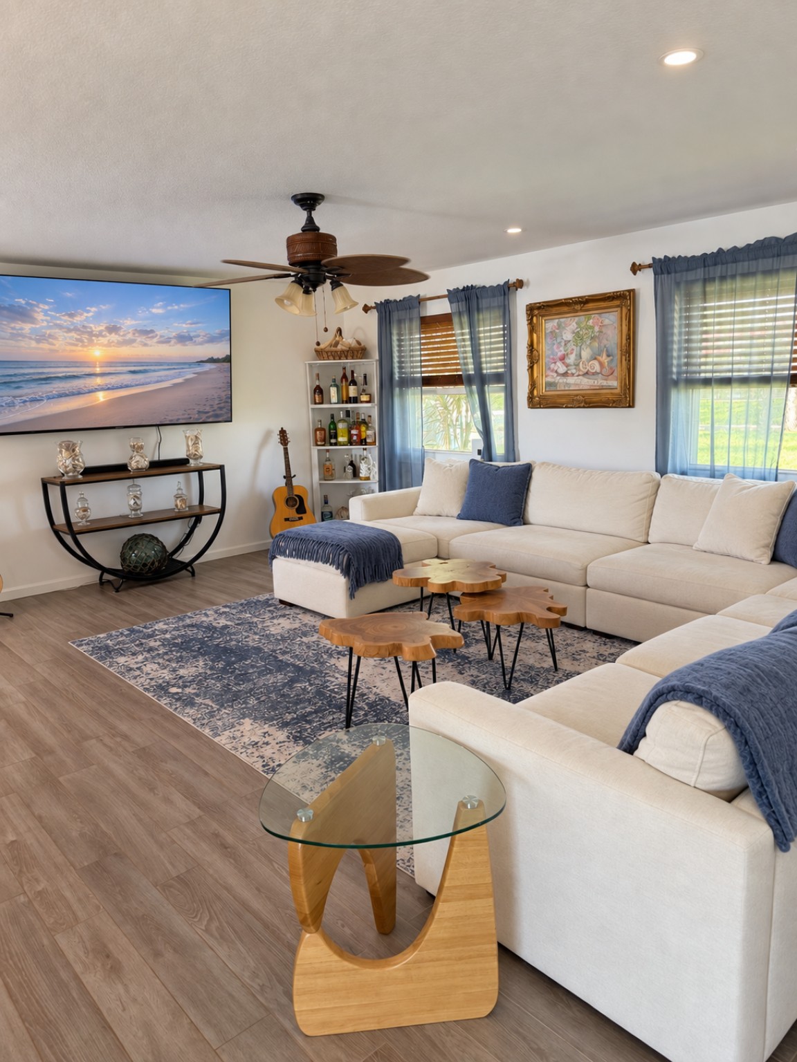 Living room with a white sectional and coastal blue accents